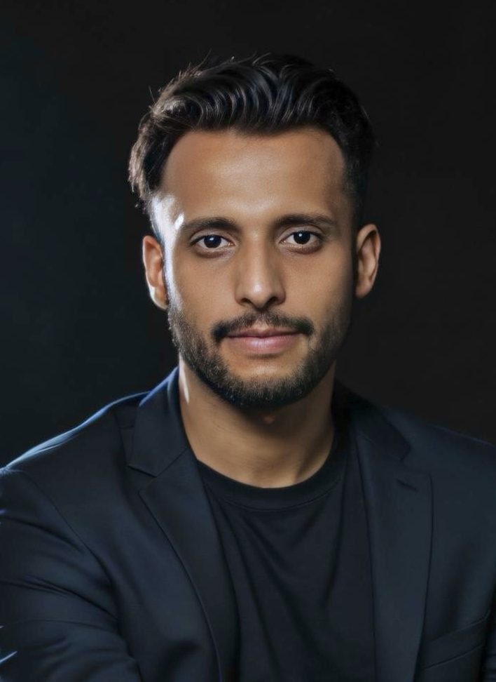 Picture of Himanshu Atre wearing a black suit over a black t-shirt