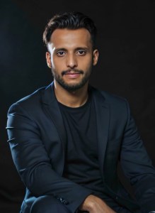 Picture of Himanshu Atre wearing a black suit over a black t-shirt